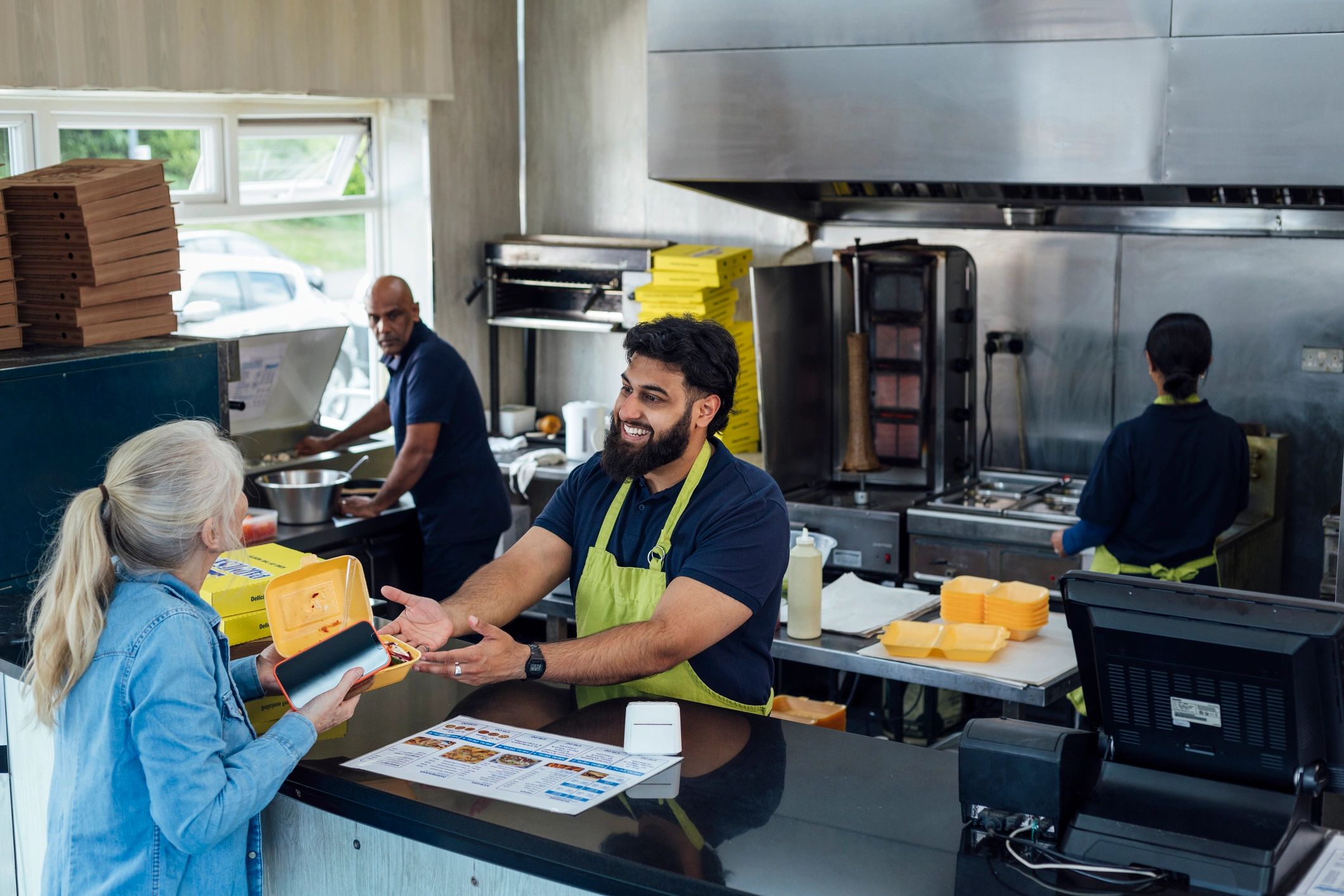 Quick commerce order handoff at a food pickup counter