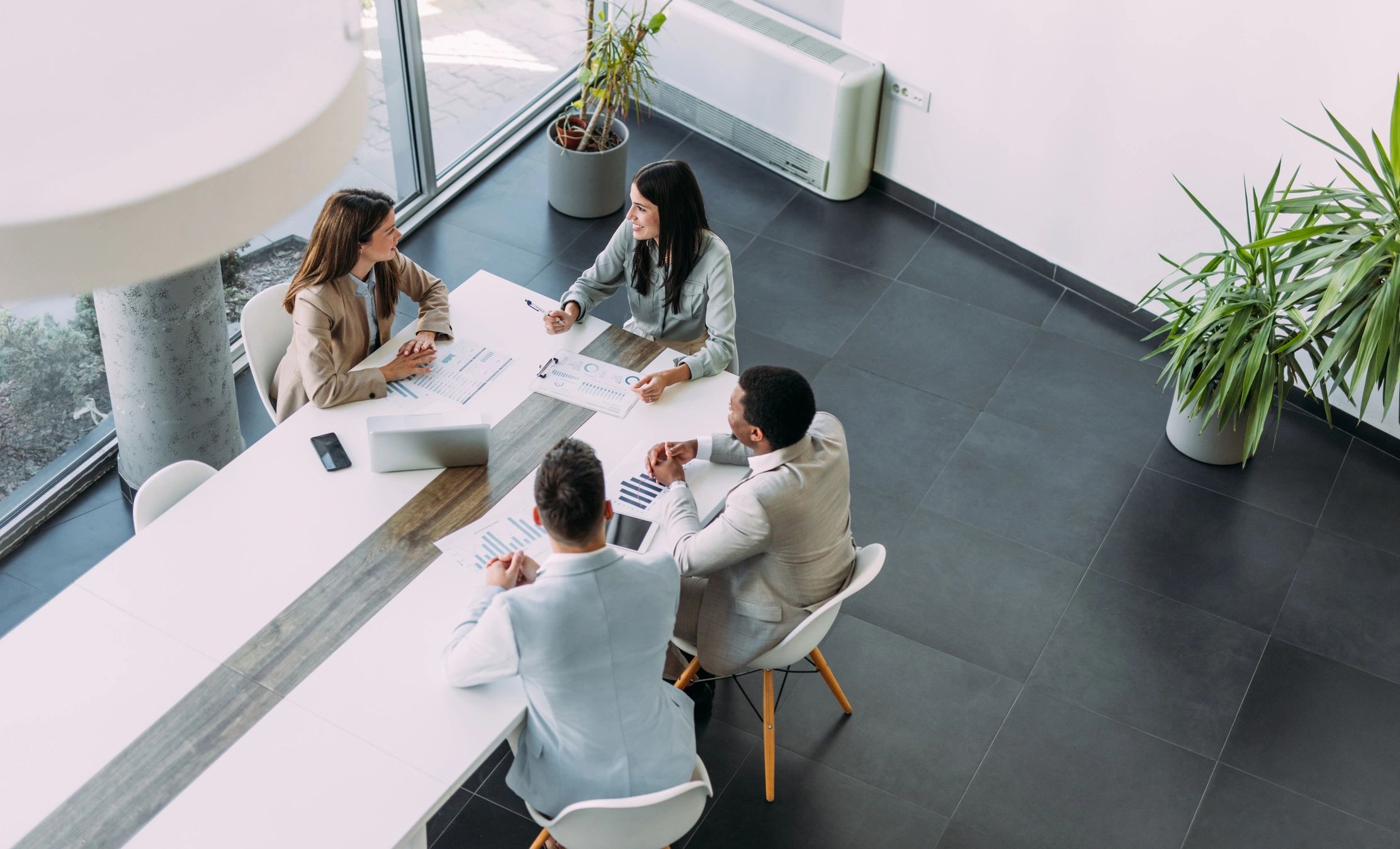 Business team gathered around a meeting table