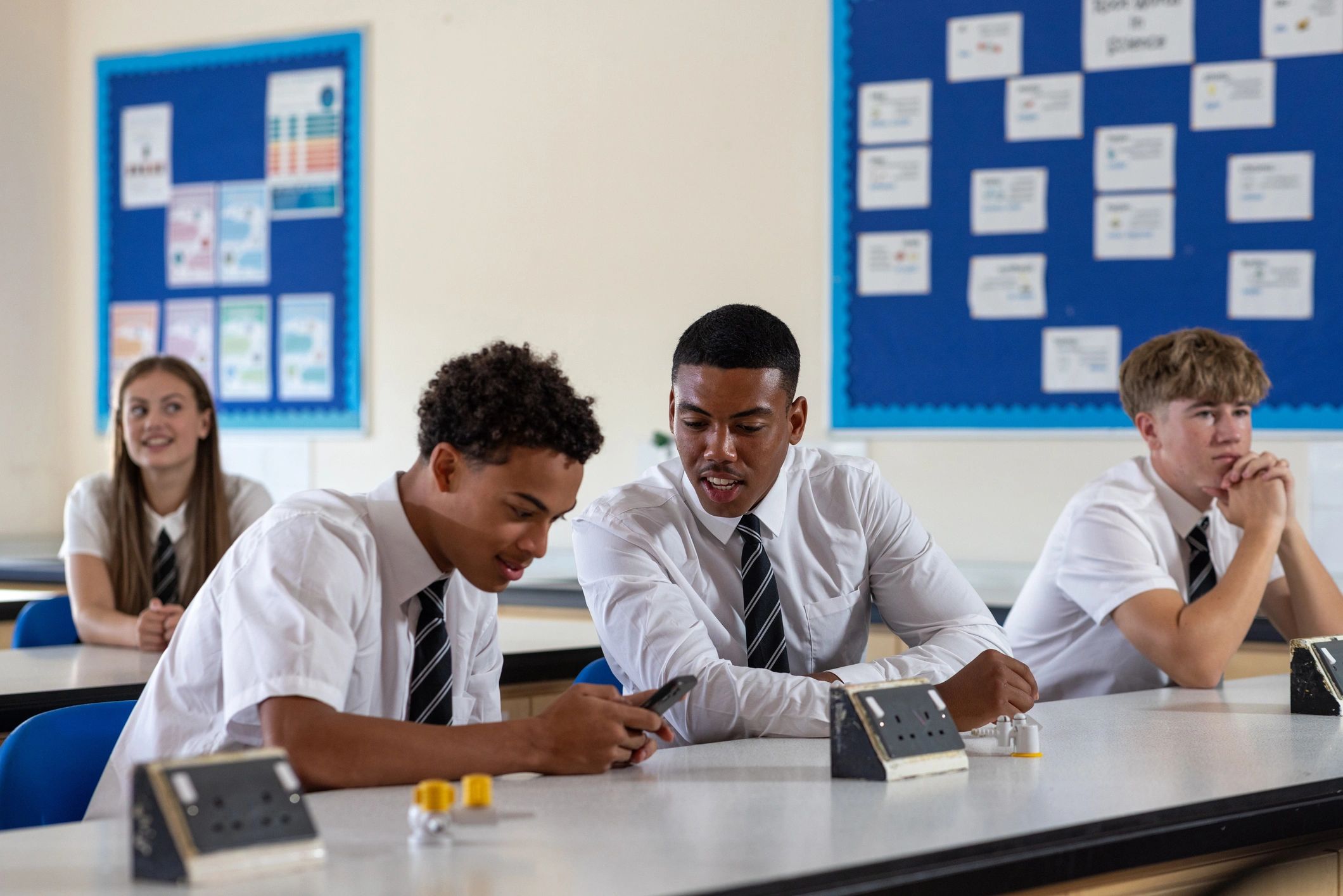 Students in a classroom using technology